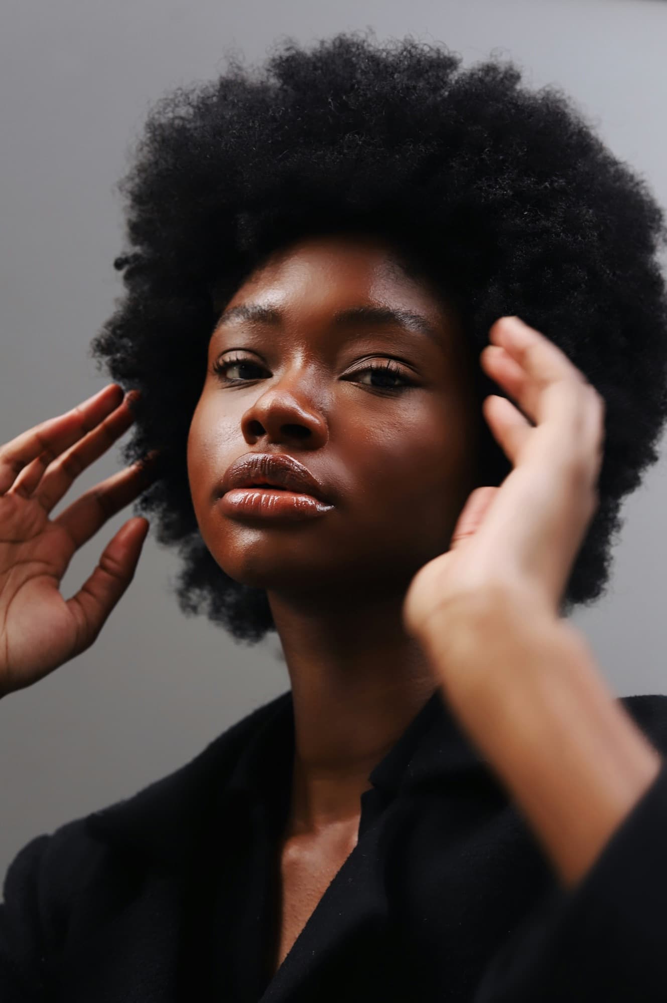 Woman with natural hair worn in an afro